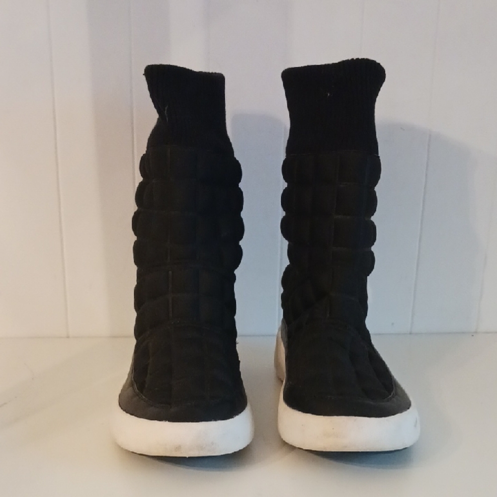 Unified Nude Black Quilted Boots.